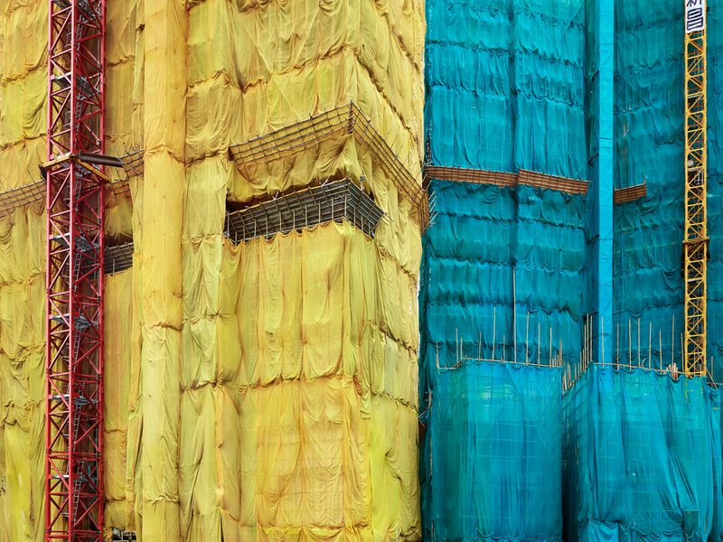 Illustration for article titled The Surreal Sight of Skyscrapers Encased in Colored Fabric